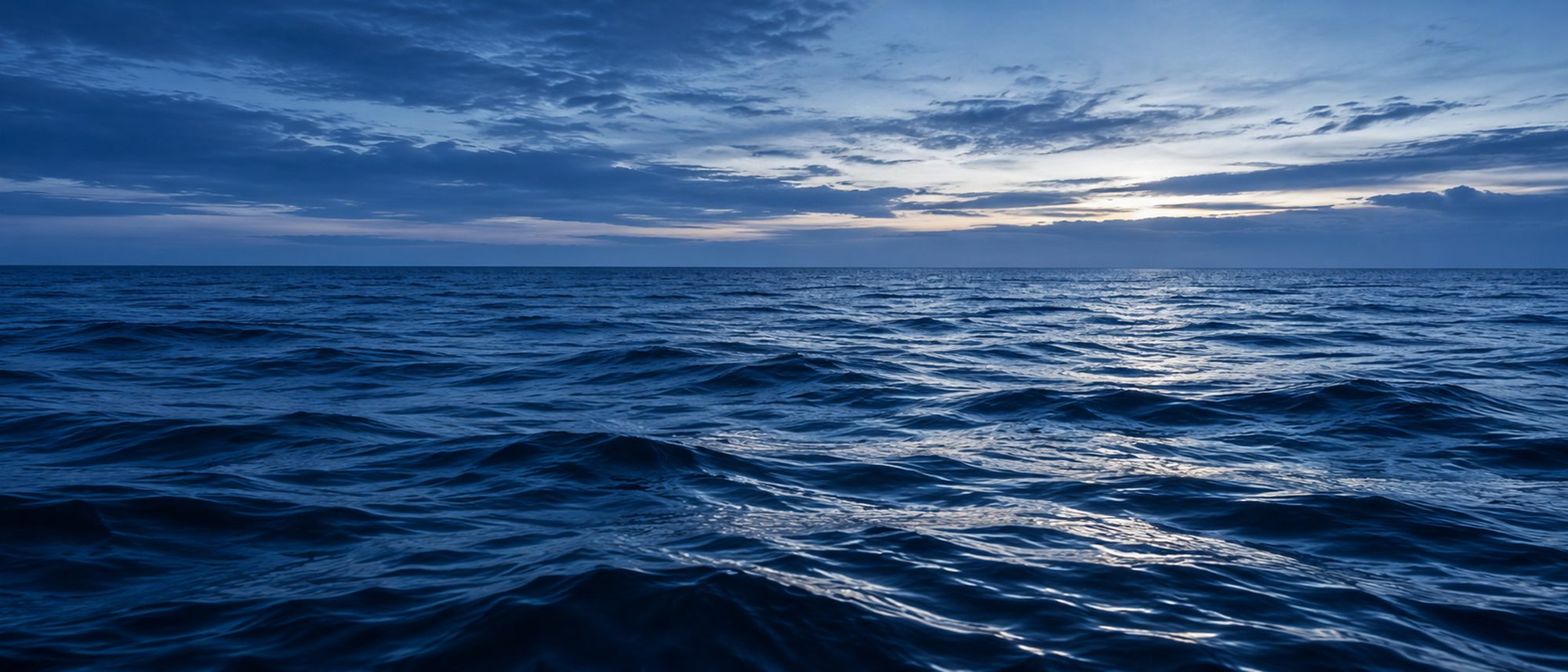 Open sea viewed from the deck of a working vessel